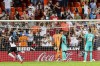 Real Madrid's players react after Valencia's Hugo Duro scores his side's first goal during a Spanish La Liga soccer match between Valencia and Real Madrid at the Mestalla stadium in Valencia, Spain, Sunday, Sept. 19, 2021. (AP Photo/Alberto Saiz)