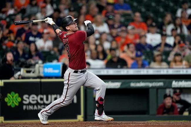 Arizona Diamondbacks' Carson Kelly hits an RBI single against the Houston Astros during the fourth inning of a baseball game Sunday, Sept. 19, 2021, in Houston. (AP Photo/David J. Phillip)
