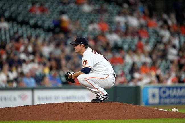 Houston Astros starting pitcher Zack Greinke waits for the next batter after giving up a home run to Arizona Diamondbacks' Pavin Smith during the third inning of a baseball game Sunday, Sept. 19, 2021, in Houston. (AP Photo/David J. Phillip)