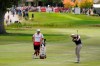 Scott Stallings, right, hits his approach shot from the first fairway of the Silverado Resort North Course during the final round of the Fortinet Championship PGA golf tournament Sunday, Sept. 19, 2021, in Napa, Calif. (AP Photo/Eric Risberg)