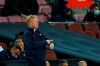 Barcelona's head coach Ronald Koeman points to his watch during the Spanish La Liga soccer match between Barcelona and Granada, at the Camp Nou stadium in Barcelona, Spain, Monday, Sept. 20, 2021. (AP Photo/Joan Monfort)