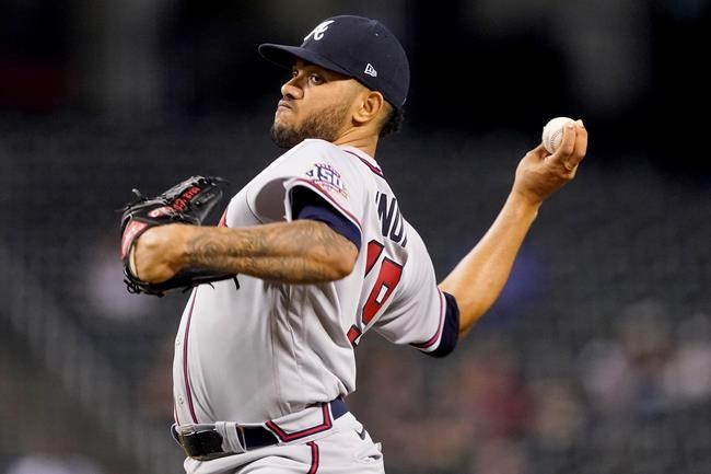 Atlanta Braves starting pitcher Huascar Ynoa throws against the Arizona Diamondbacks during the first inning of a baseball game, Monday, Sept. 20, 2021, in Phoenix. (AP Photo/Matt York)