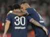 PSG's Neymar, right, celebrates with Lionel Messi after scoring his side's first goal during the French League One soccer match between Paris Saint-Germain and Lyon at the Parc des Princes in Paris Sunday, Sept. 19, 2021. (AP Photo/Francois Mori)