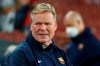 Barcelona's head coach Ronald Koeman grimaces during the Spanish La Liga soccer match between Barcelona and Granada, at the Camp Nou stadium in Barcelona, Spain, Monday, Sept. 20, 2021. (AP Photo/Joan Monfort)