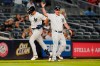 New York Yankees' Phil Nevin, right, celebrates with New York Yankees' Joey Gallo as he runs the bases after hitting a home run during the sixth inning of a baseball game against the Texas Rangers Tuesday, Sept. 21, 2021, in New York. (AP Photo/Frank Franklin II)