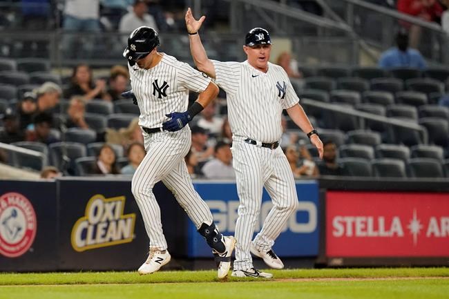 New York Yankees' Phil Nevin, right, celebrates with New York Yankees' Joey Gallo as he runs the bases after hitting a home run during the sixth inning of a baseball game against the Texas Rangers Tuesday, Sept. 21, 2021, in New York. (AP Photo/Frank Franklin II)
