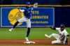 Toronto Blue Jays shortstop Bo Bichette forces Tampa Bay Rays' Manuel Margot, right, at second base and turns a double play on Kevin Kiermaier during the second inning of a baseball game Tuesday, Sept. 21, 2021, in St. Petersburg, Fla. (AP Photo/Chris O'Meara)