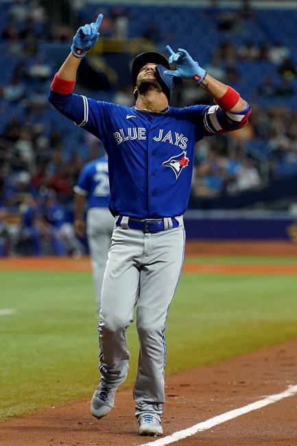 Toronto Blue Jays' Lourdes Gurriel Jr. celebrates his solo home run off Tampa Bay Rays' Drew Rasmussen during the fifth inning of a baseball game Tuesday, Sept. 21, 2021, in St. Petersburg, Fla. (AP Photo/Chris O'Meara)
