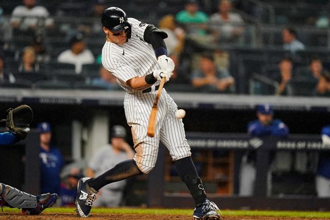 New York Yankees' Aaron Judge hits a three-run home run during the seventh inning of a baseball game against the Texas Rangers Tuesday, Sept. 21, 2021, in New York. (AP Photo/Frank Franklin II)