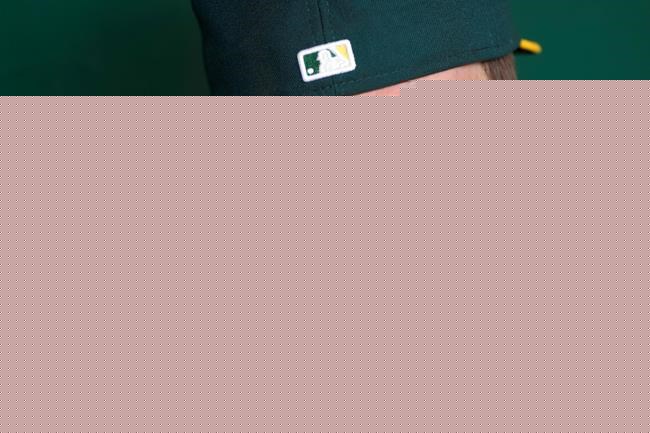 Oakland Athletics pitcher Chris Bassitt speaks to reporters before a baseball game between the Athletics and the New York Yankees in Oakland, Calif., Saturday, Aug. 28, 2021. Bassitt returned to the Bay Area on Friday following facial surgery in Chicago, where he was hit with a line drive the week before. (AP Photo/Jeff Chiu)