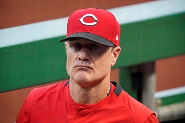 Cincinnati Reds manager David Bell stands in the dugout during a baseball game against the Pittsburgh Pirates in Pittsburgh, Tuesday, Sept. 14, 2021. (AP Photo/Gene J. Puskar)