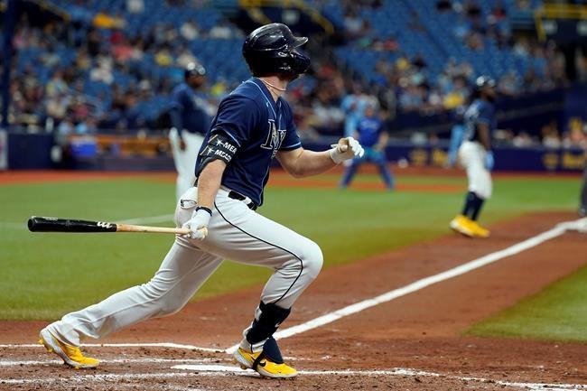 Tampa Bay Rays' Austin Meadows watches his three-run home run off Toronto Blue Jays pitcher Ross Stripling during the third inning of a baseball game Wednesday, Sept. 22, 2021, in St. Petersburg, Fla. (AP Photo/Chris O'Meara)