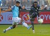 HFX Wanderers FC's Eriks Santos, left, tries to block a shot from CF Montreal's Ballou Tabla during 2021 Canadian Championship quarterfinal soccer action in Halifax on Wednesday September 22, 2021.THE CANADIAN PRESS/Tim Krochak
