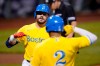 Boston Red Sox's Kyle Schwarber, left, is congratulated by Xander Bogaerts (2) after his solo home run off New York Mets starting pitcher Taijuan Walker during the first inning of a baseball game at Fenway Park, Wednesday, Sept. 22, 2021, in Boston. (AP Photo/Charles Krupa)