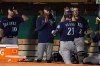 Seattle Mariners' Ty France (23) is congratulated by teammates after hitting a home run against the Oakland Athletics during the fifth inning of a baseball game in Oakland, Calif., Wednesday, Sept. 22, 2021. (AP Photo/Jeff Chiu)