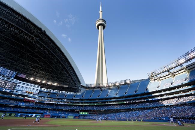 Toronto Blue Jays starting pitcher Ross Stripling (48) throws the opening pitch of the Toronto Blue Jays first home game of the 2021 season at the Rogers Centre in Toronto against the Kansas City Royals during MLB action on Friday, July 30, 2021. THE CANADIAN PRESS/Peter Power