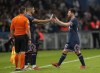 PSG's Lionel Messi is replaced by Achraf Hakimi as he is substituted during the French League One soccer match between Paris Saint-Germain and Lyon at the Parc des Princes in Paris Sunday, Sept. 19, 2021. (AP Photo/Francois Mori)