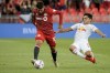 Toronto FC midfielder Alejandro Pozuelo (10) is defended by New York Red Bulls midfielder Frankie Amaya (8) during first half MLS soccer action in Toronto, Wednesday, July 21, 2021. THE CANADIAN PRESS/Chris Katsarov