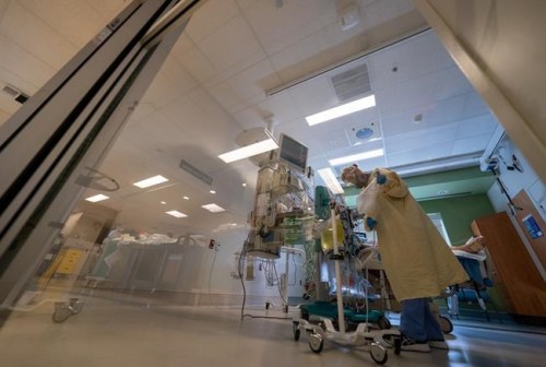 A registered nurse attends to a patient in the COVID-19 Intensive Care Unit at Surrey Memorial Hospital in Surrey, B.C., Friday, June 4, 2021. THE CANADIAN PRESS/Jonathan Hayward