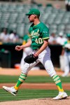 Oakland Athletics pitcher Chris Bassitt reacts after striking out Seattle Mariners' Ty France during the third inning of a baseball game in Oakland, Calif., Thursday, Sept. 23, 2021. (AP Photo/Jeff Chiu)