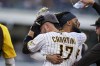 San Diego Padres' Victor Caratini (17) celebrates with Fernando Tatis Jr., second from right, and teammates after reaching on an RBI-single to defeat the San Francisco Giants in a baseball game Thursday, Sept. 23, 2021, in San Diego. (AP Photo/Gregory Bull)
