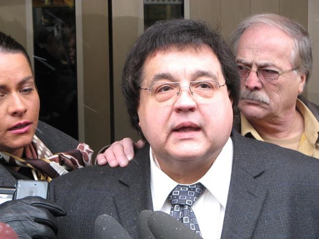 Frank Ostrowski talks to reporters in Winnipeg on Friday, Dec. 18, 2009. THE CANADIAN PRESS/Steve Lambert