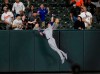 Texas Rangers left fielder DJ Peters makes a catch on a fly ball hit by Baltimore Orioles' Pat Valaika for an out during the fourth inning of a baseball game, Friday, Sept. 24, 2021, in Baltimore. (AP Photo/Nick Wass)