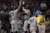 New York Yankees designated hitter Giancarlo Stanton (27) celebrates with Aaron Judge after hitting him in on a three-run home run during the third inning of a baseball game against the Boston Red Sox at Fenway Park, Friday, Sept. 24, 2021, in Boston. (AP Photo/Mary Schwalm)