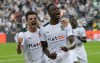 Moenchengladbach's scorer Denis Zakaria, right, celebrates with Moenchengladbach's Jonas Hofmann, left, after he scored the opening goal during the German Bundesliga soccer match between Borussia Moenchengladbach and Borussia Dortmund in Moenchengladbach, Germany, Saturday, Sept. 25, 2021. (AP Photo/Martin Meissner)