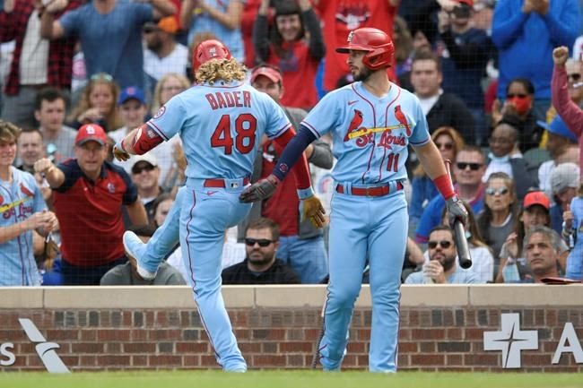 St. Louis Cardinals' Harrison Bader (48) celebrates with teammate Paul DeJong (11) after hitting a solo home run during the second inning of a baseball game against the Chicago Cubs Saturday, Sept. 25, 2021, in Chicago. (AP Photo/Paul Beaty)