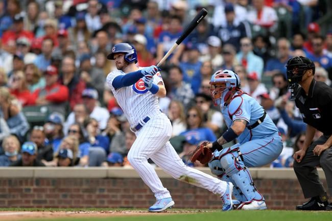Chicago Cubs' Ian Happ watches his RBI single during the third inning of a baseball game against the St. Louis Cardinals Saturday, Sept. 25, 2021, in Chicago. (AP Photo/Paul Beaty)