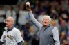 Broadcaster Bob Uecker, right, waves to the crowd after throwing out the ceremonial first pitch before a baseball game between the Milwaukee Brewers and the New York Mets Saturday, Sept. 25, 2021, in Milwaukee. (AP Photo/Aaron Gash)