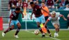 Colorado Rapids defender Auston Trusty, left, and midfielder Mark-Anthony Kaye (14) keep Toronto FC midfielder Yeferson Soteldo (30) away from the ball in the first half of an MLS soccer game in Denver, Saturday, Sept. 25, 2021. (AP Photo/Joe Mahoney)