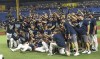 Tampa Bay Rays players and coaches celebrate after beating the Miami Marlins 7-3 to clinch the American League East during a baseball game Saturday, Sept. 25, 2021, in St. Petersburg, Fla. (AP Photo/Steve Nesius)
