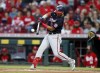 Washington Nationals' Luis García hits an RBI-single against Cincinnati Reds pitcher Vladimir Gutierrez during the first inning of a baseball game in Cincinnati, Saturday, Sept. 25, 2021. (AP Photo/Paul Vernon)