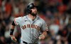 San Francisco Giants' Brandon Belt follows the flight of his three-run home run off Colorado Rockies starting pitcher Jon Gray in the fifth inning of a baseball game Saturday, Sept. 25, 2021, in Denver. (AP Photo/David Zalubowski)