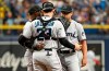 Miami Marlins catcher Alex Jackson (23) and shortstop Jazz Chisholm Jr., left, talk with starter Jesus Luzardo, right, on the mound during the first inning of a baseball game against the Tampa Bay Rays, Sunday, Sept. 26, 2021, in St. Petersburg, Fla. (AP Photo/Steve Nesius)