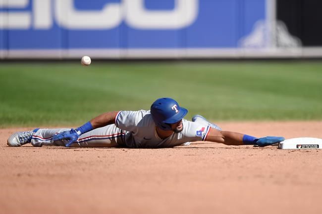 Texas Rangers' Jose Trevino is safe at second base on a steal against the Baltimore Orioles in the seventh inning of a baseball game Sunday, Sept. 26, 2021, in Baltimore. (AP Photo/Gail Burton)