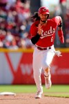 Cincinnati Reds' Jonathan India advances to third on a fly ball sacrifice against the Washington Nationals during the seventh inning of a baseball game Sunday, Sept. 26, 2021, in Cincinnati. The Reds defeated the Nationals 9-2. (AP Photo/Jay LaPrete)