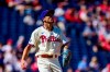 Philadelphia Phillies staring pitcher Hans Crouse watches a solo home run hit by Pittsburgh Pirates' Cole Tucker during the first inning of a baseball game, Sunday, Sept. 26, 2021, in Philadelphia. (AP Photo/Derik Hamilton)