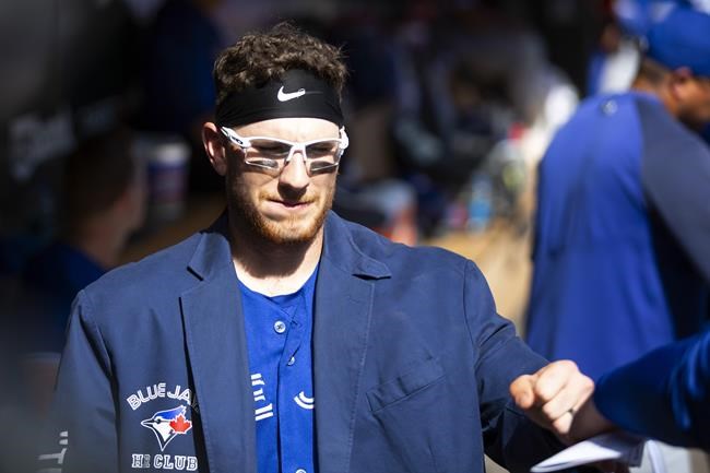 Toronto Blue Jays catcher Danny Jansen celebrates his three-runI home run in the second inning of a baseball game, Sunday, Sept. 26, 2021, in St. Paul, Minn. (AP Photo/Andy Clayton-King)