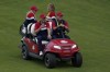 Team USA captain Steve Stricker gives Justin Thomas a ride after the Ryder Cup matches at the Whistling Straits Golf Course Sunday, Sept. 26, 2021, in Sheboygan, Wis. (AP Photo/Jeff Roberson)