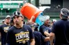 Milwaukee Brewers manager Craig Counsell is doused after a baseball game against the New York Mets, Sunday, Sept. 26, 2021, in Milwaukee. The Brewers clinched the National League Central Division. (AP Photo/Aaron Gash)