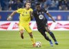 CF Montreal's Victor Wanyama (2) challenges Nashville SC's Daniel Rios during first half MLS soccer action in Montreal on September 11, 2021. THE CANADIAN PRESS/Graham Hughes