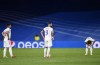Real Madrid's Karim Benzema, center, Luka Jovic, left, and Luka Modric reacts after Sheriff's Sebastien Thill scoring his side's second goal during the Champions League group D soccer match between Real Madrid and Sheriff, Tiraspol at the Bernabeu stadium in Madrid, Spain, Tuesday, Sept. 28, 2021. (AP Photo/Jose Breton)