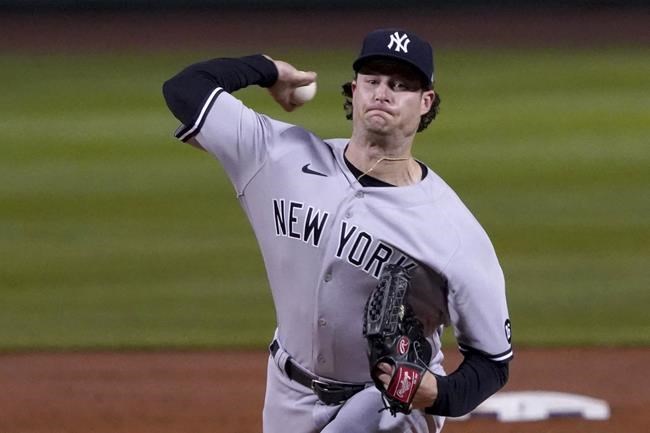 New York Yankees starting pitcher Gerrit Cole (45) throws to a Boston Red Sox batter during the first inning of a baseball game at Fenway Park, Friday, Sept. 24, 2021, in Boston. (AP Photo/Mary Schwalm)