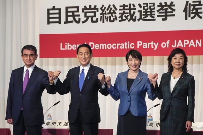 FILE - In this Sept. 17, 2021, file photo, candidates for the presidential election of the ruling Liberal Democratic Party pose prior to a joint news conference at the party's headquarters in Tokyo. Japan's governing party will vote Wednesday, Sept. 29, 2021 to pick its new leader who is presumed next prime minister with crucial tasks such as addressing a pandemic-hit economy and ensuring strong alliance with Washington amid growing security risks from China and North Korea. The contenders are, from left to right, Taro Kono, the cabinet minister in charge of vaccinations, Fumio Kishida, former foreign minister, Sanae Takaichi, former internal affairs minister, and Seiko Noda, former internal affairs minister. (Kimimasa Mayama/Pool Photo via AP, File)