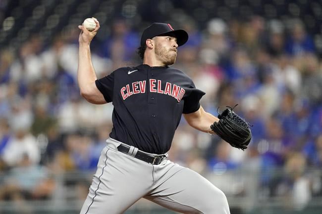 Cleveland Indians starting pitcher Aaron Civale throws during the first inning of a baseball game against the Kansas City Royals Tuesday, Sept. 28, 2021, in Kansas City, Mo. (AP Photo/Charlie Riedel)