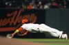 San Francisco Giants shortstop Brandon Crawford (35) makes a diving stop of Arizona Diamondbacks' Kole Calhoun's infield single during the fourth inning of a baseball game, Tuesday, Sept. 28, 2021, in San Francisco. (AP Photo/D. Ross Cameron)