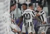 Juventus' Federico Chiesa, right, celebrates with teammates after scoring his side's opening goal during the Champions League group H soccer match between Juventus and Chelsea at the Allianz stadium in Turin, Italy, Wednesday, Sept. 29, 2021. (AP Photo/Antonio Calanni)